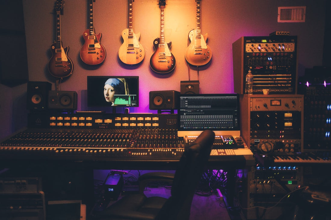A vintage analog mixing console in a professional recording studio